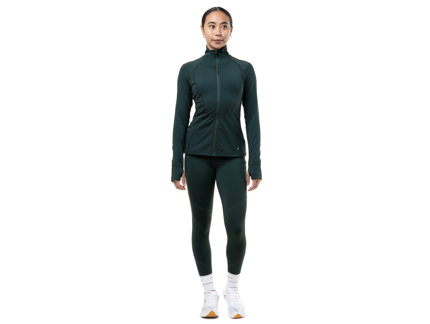 Person wearing a green athletic outfit on a white background