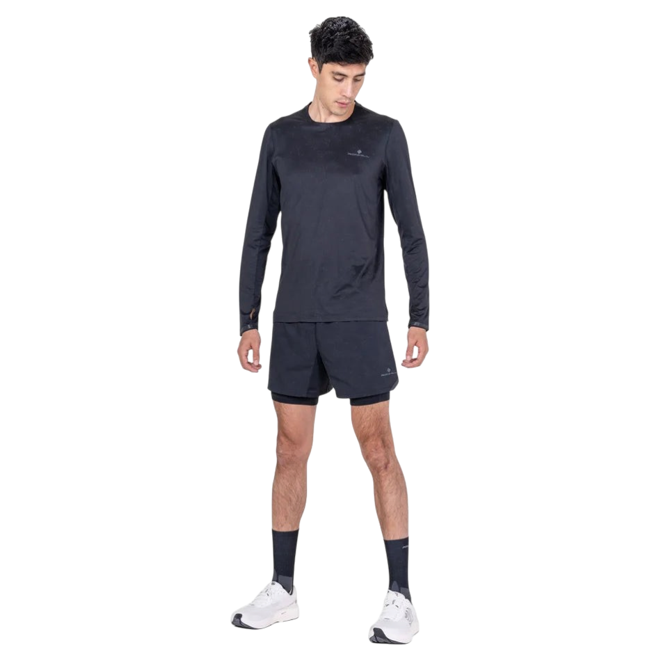 Up & Running Ronhill men's black long-sleeved running tee with reflective details worn by a male model