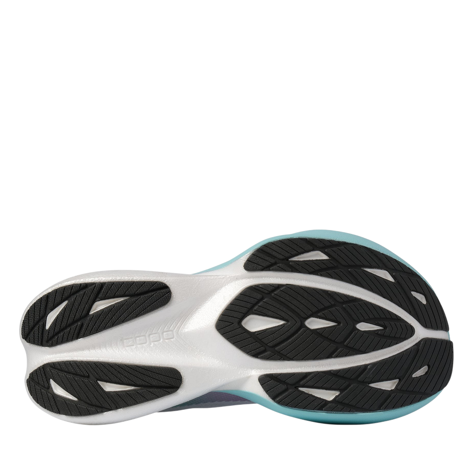 Up & Running Topo Women's Specter 3 running shoes in white and teal, showing the detailed black rubber outsole tread.