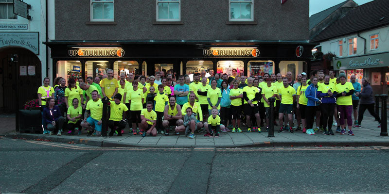 local running group outside Up & Running store
