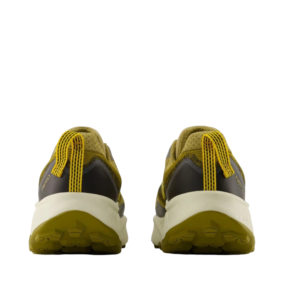 Up & Running New Balance Hierro v9 trail running shoes in quicksand, orange, and black, rear view showing lugged sole.