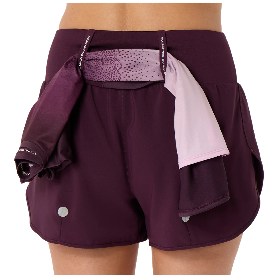 Up & Running ASICS women's dark aubergine running shorts with an elasticated loop system for gear storage