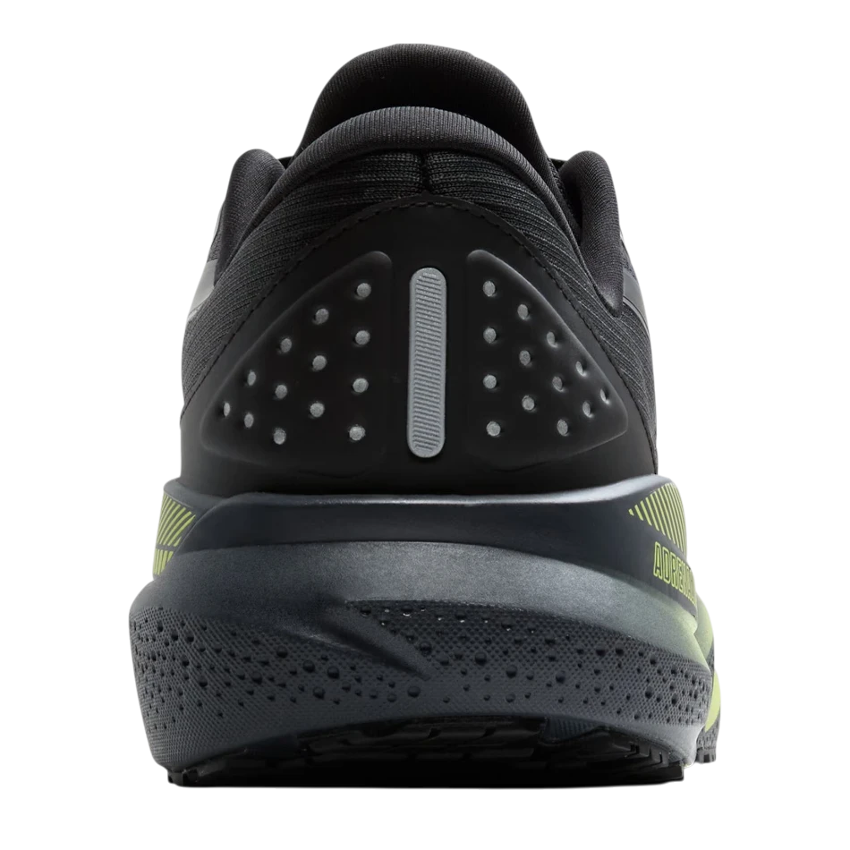Up & Running Brooks Adrenaline GTS 24 weatherized running shoe in black and yellow, showing the heel and support detail.
