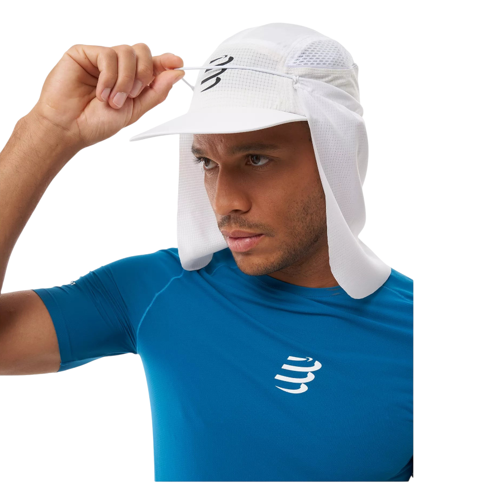 Up & Running Compressport white racing cap with removable neck protector and ice pocket on a runner