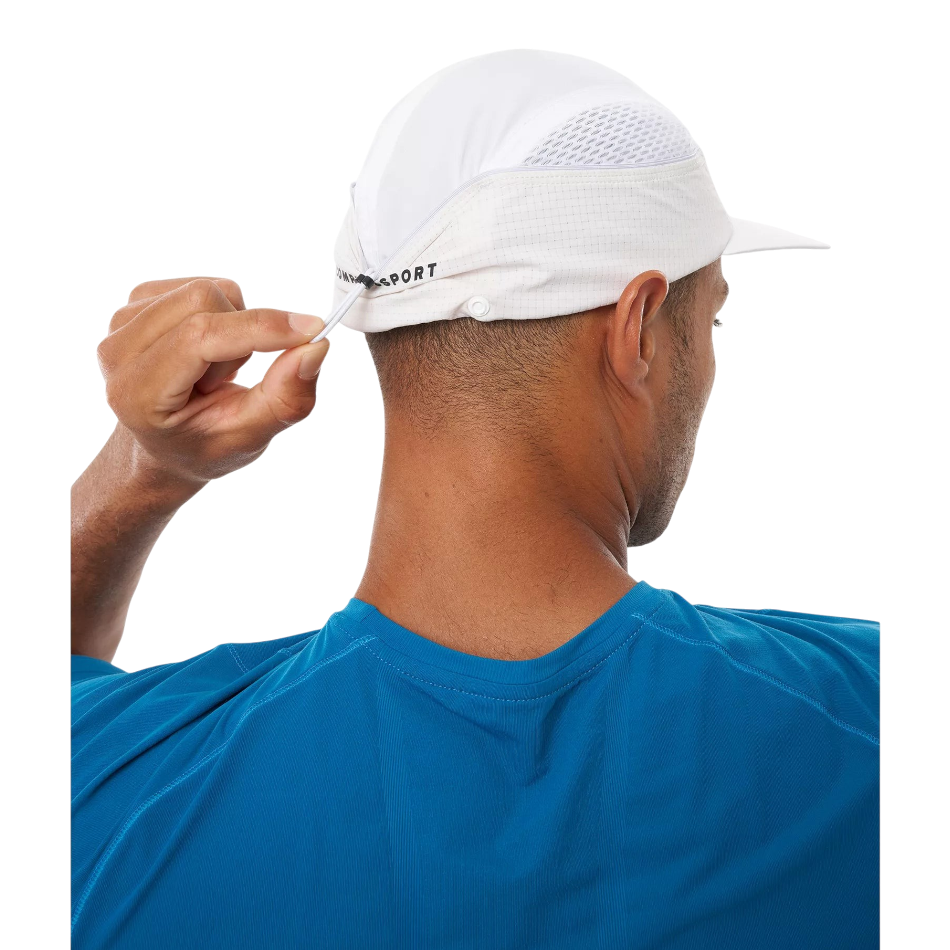 Up & Running Compressport white racing cap with rear adjustment toggle for a secure fit during endurance runs