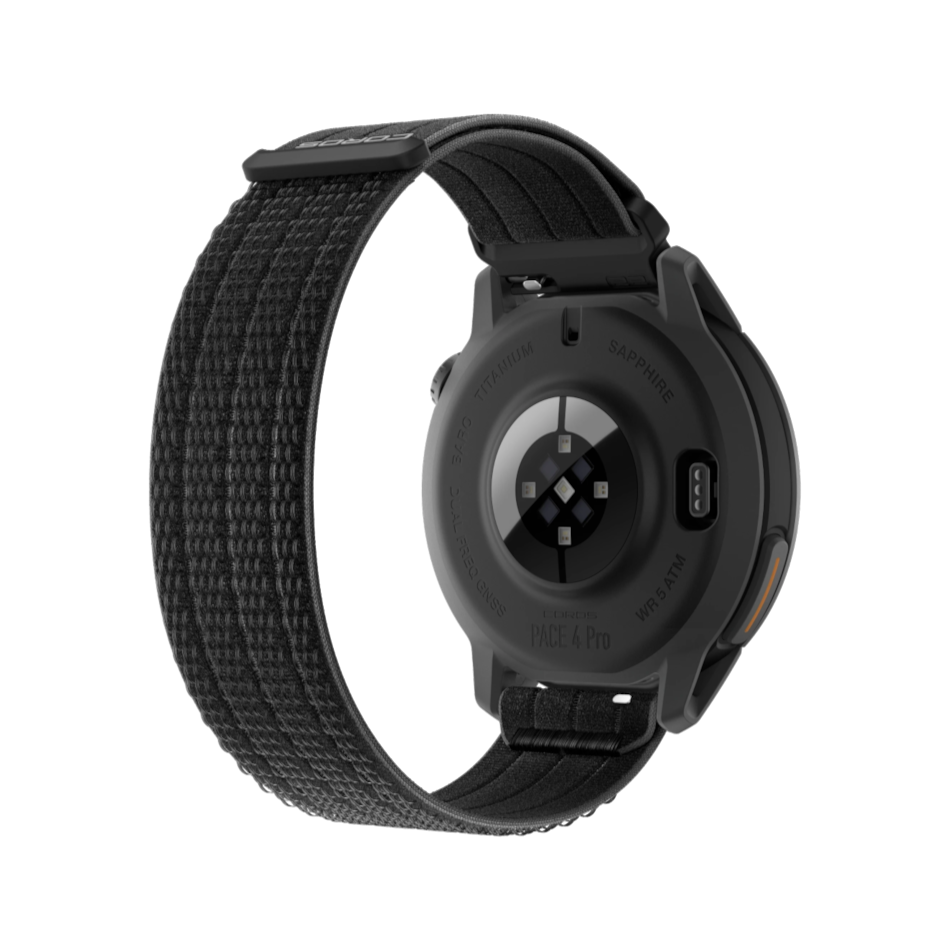 Up & Running Coros Pace 4 Pro GPS sport watch in black with a durable nylon strap, showing the sensor back view.