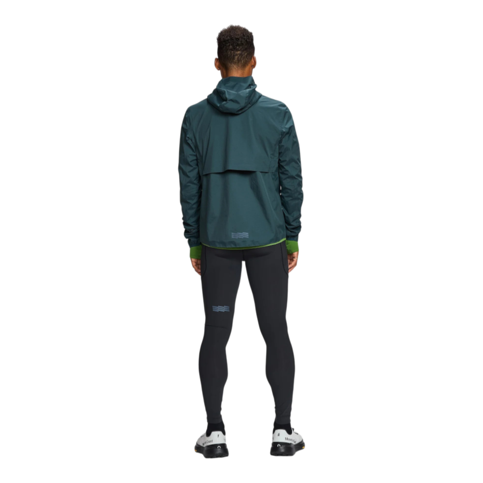 Up & Running Janji Men's Rainrunner Pack Jacket in Atlantis, a waterproof teal running shell viewed from the back.