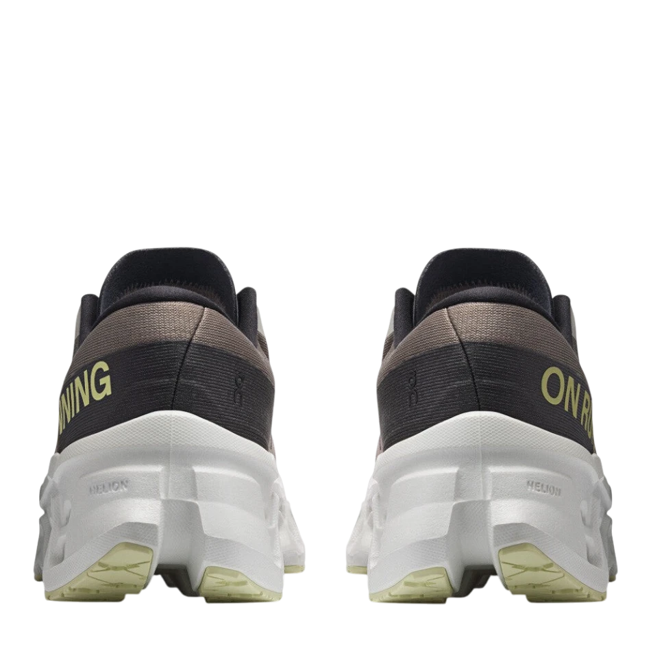 Up & Running On Women's Cloudmonster 3 running shoes in cinder and ivory, showing the rear view of the cushioned soles.