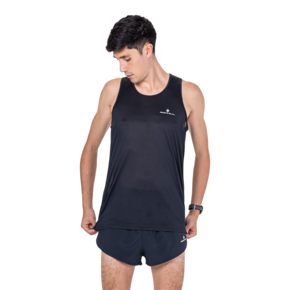 Up & Running male runner wearing a black Ronhill Core running vest with a lightweight sleeveless design