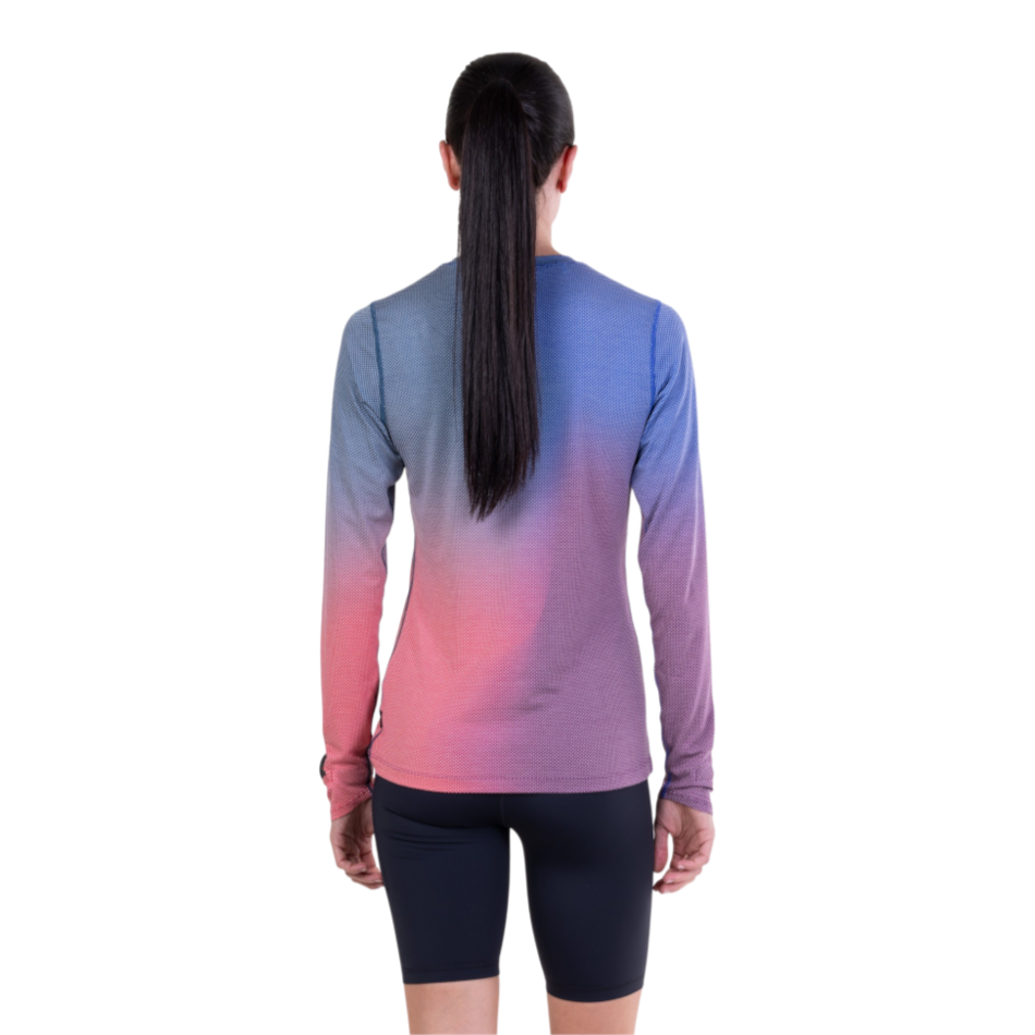 Back view of a woman wearing the Up & Running Ronhill Tech Golden Hour long-sleeved running tee in blue violet merge.